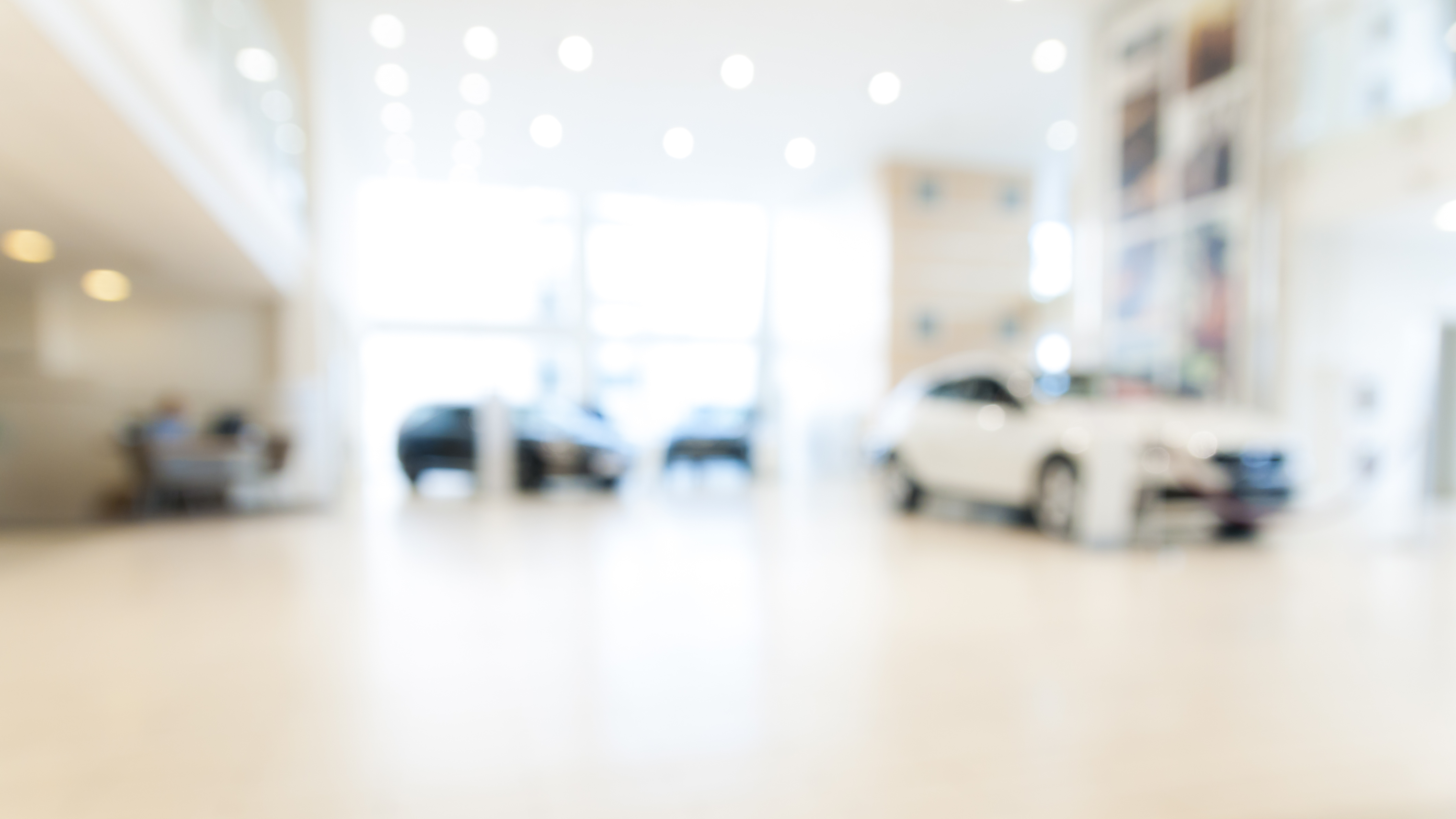 Abstract background of blurred new cars dealership place